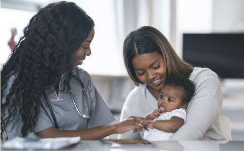 Doctor, woman and baby